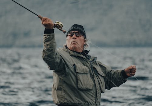 A man enjoying fly fishing in a scenic outdoor location, showcasing technique and passion.